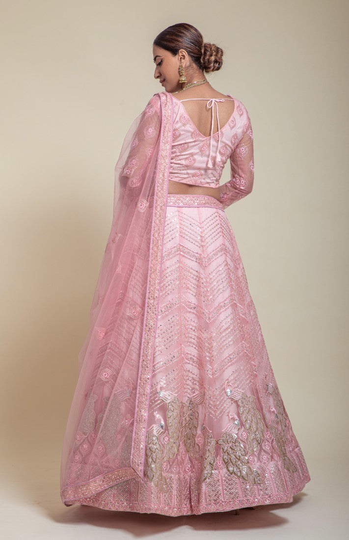 Pinkish Lehengacholi in designer work with foil embedded peacock
