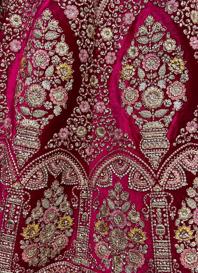 Exceptional craftsmanship on velvet embedded with different kind of embroidery bridal Rani Pink Lehengacholi