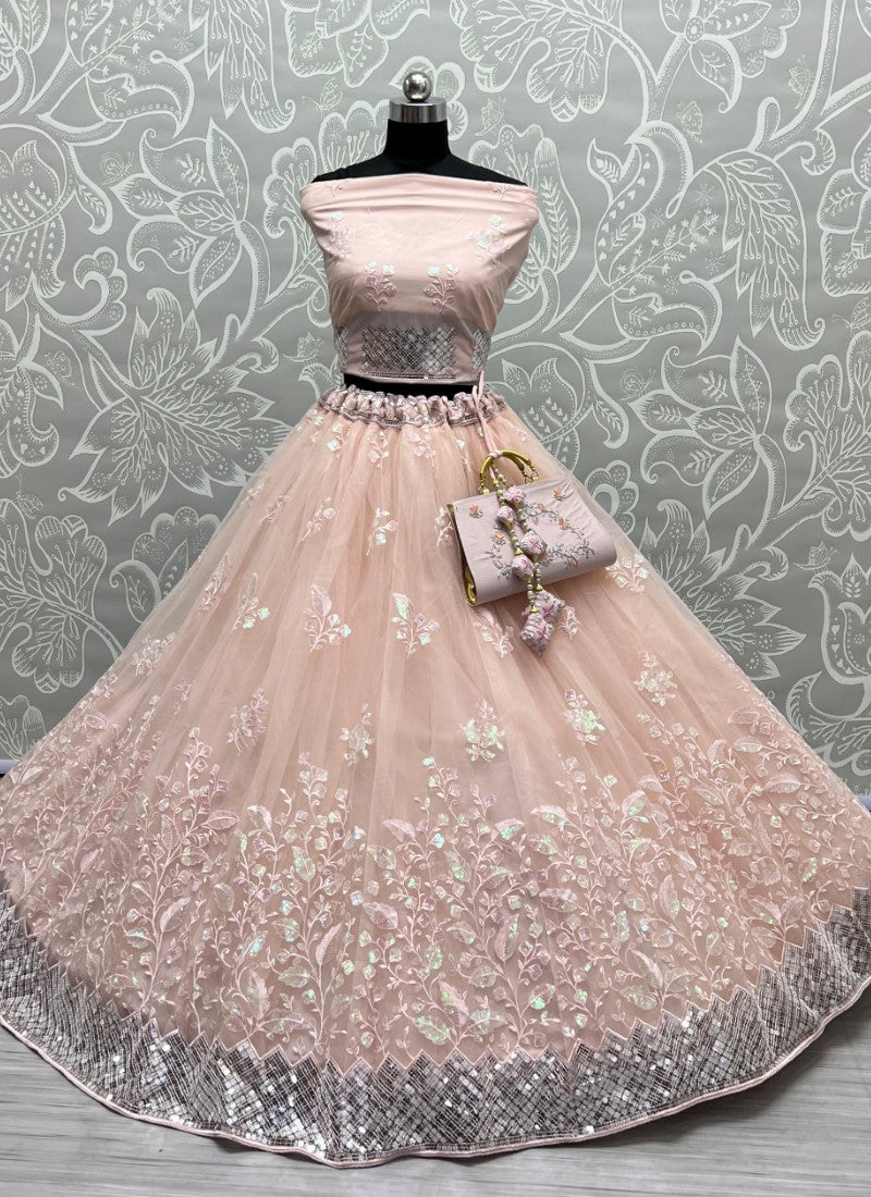 Rainbow Sequins and designer leaf embroidered Peach Lehengacholi with matching purse and Latkan