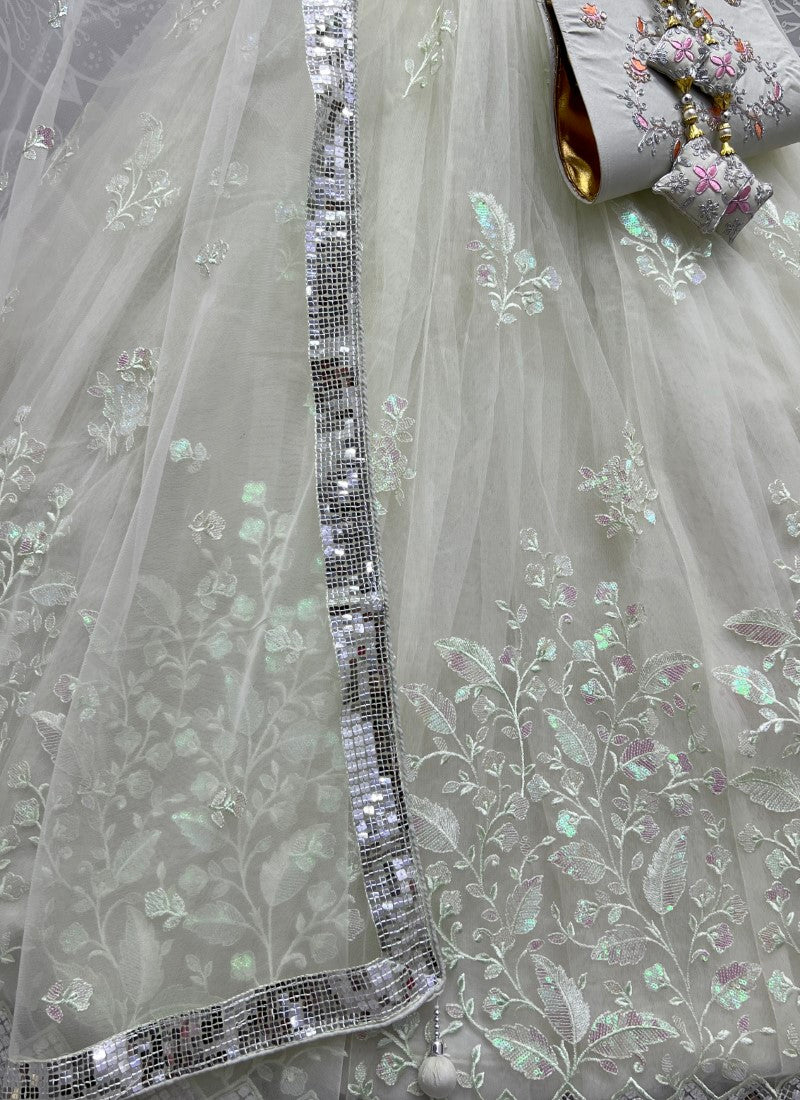 Rainbow Sequins and designer leaf embroidered Pista Lehengacholi with matching purse and Latkan