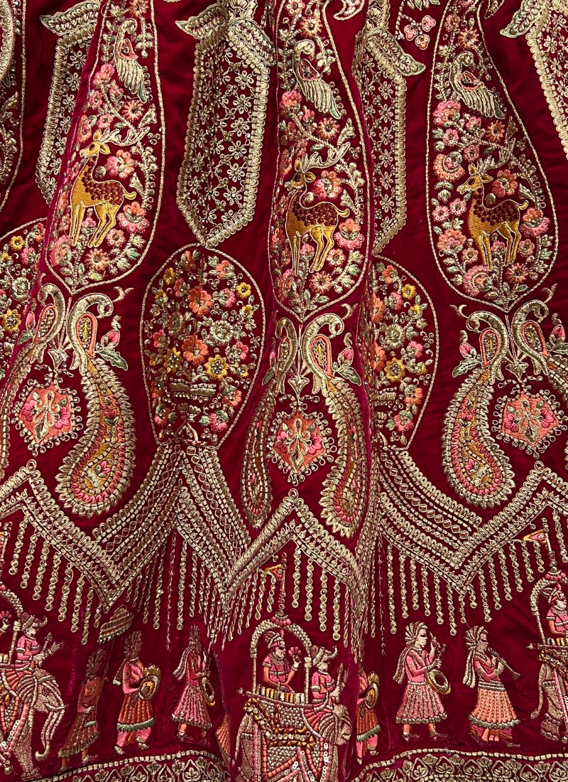 Very well crafted embroidery of peacock and Baarat designed bridal Rani Pink Lehengacholi