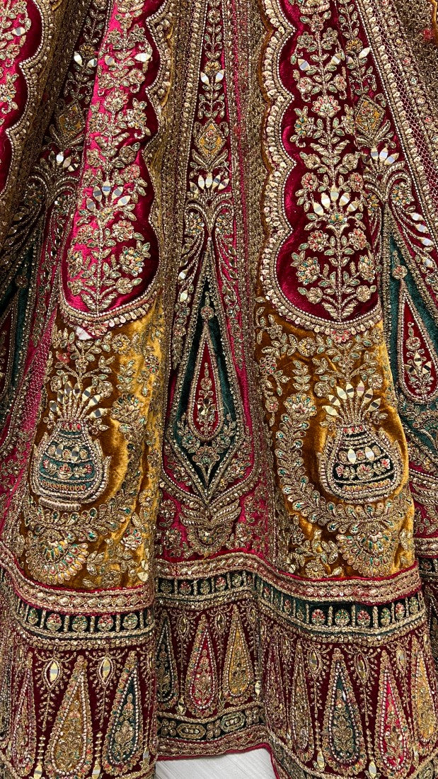 Meticulously prepared Hand mirror crafted Designer Bridal Lehengacholi in Mustard