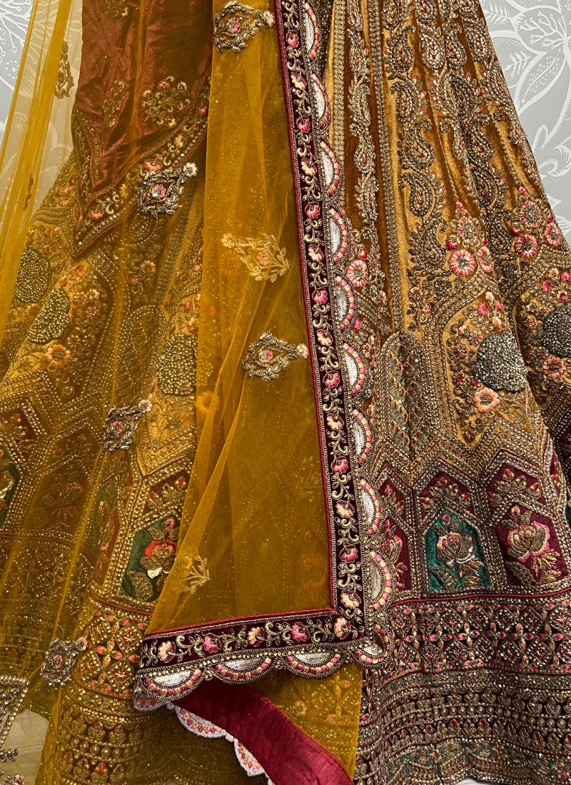 Remarkable design in various Zari and flower thread work combine Velvet patch work Lehenga choli Mustard