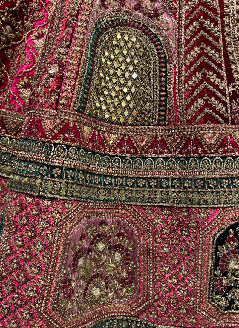 Hand mirror and sequin work on velvet Bridal Lehengacholi in Rani
