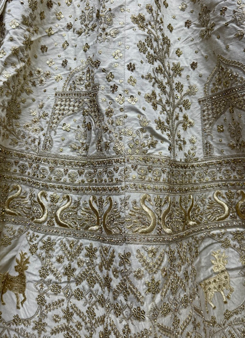 Various embroidery pattern crafted in heavy silk fabric Partywear Lehengacholi in Beige colour