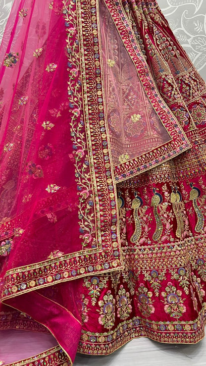 Fabulous embroidery peacock and flower pattern on velvet bridal Lehengacholi Pink