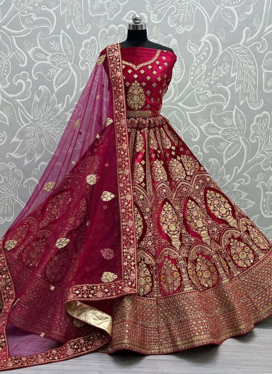 Exceptional craftsmanship on velvet embedded with different kind of embroidery bridal Rani Pink Lehengacholi