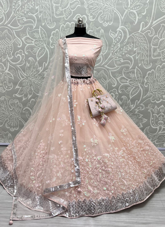 Rainbow Sequins and designer leaf embroidered Peach Lehengacholi with matching purse and Latkan