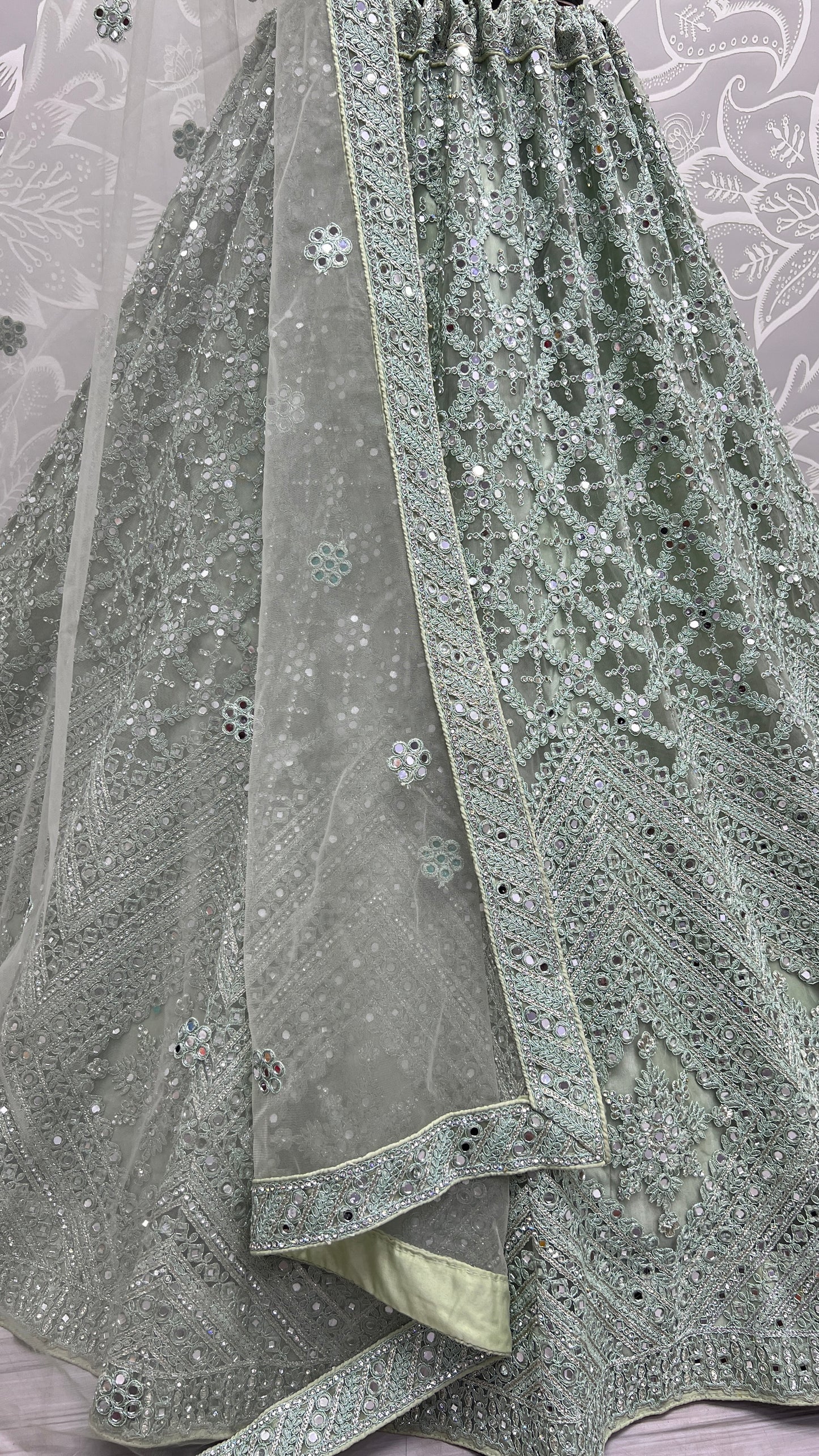 Heavy embroidery with mirror work designer Pista Lehengacholi