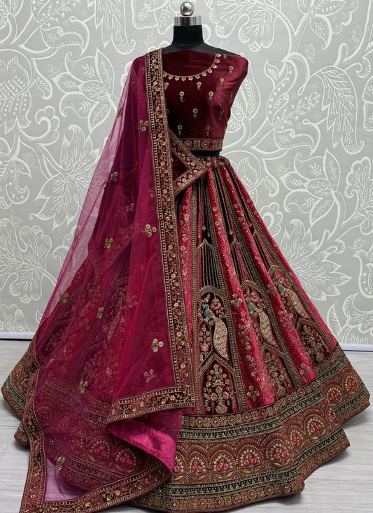 Peacock and flower pattern embroidered Velvet Lehengacholi in Rani Colour