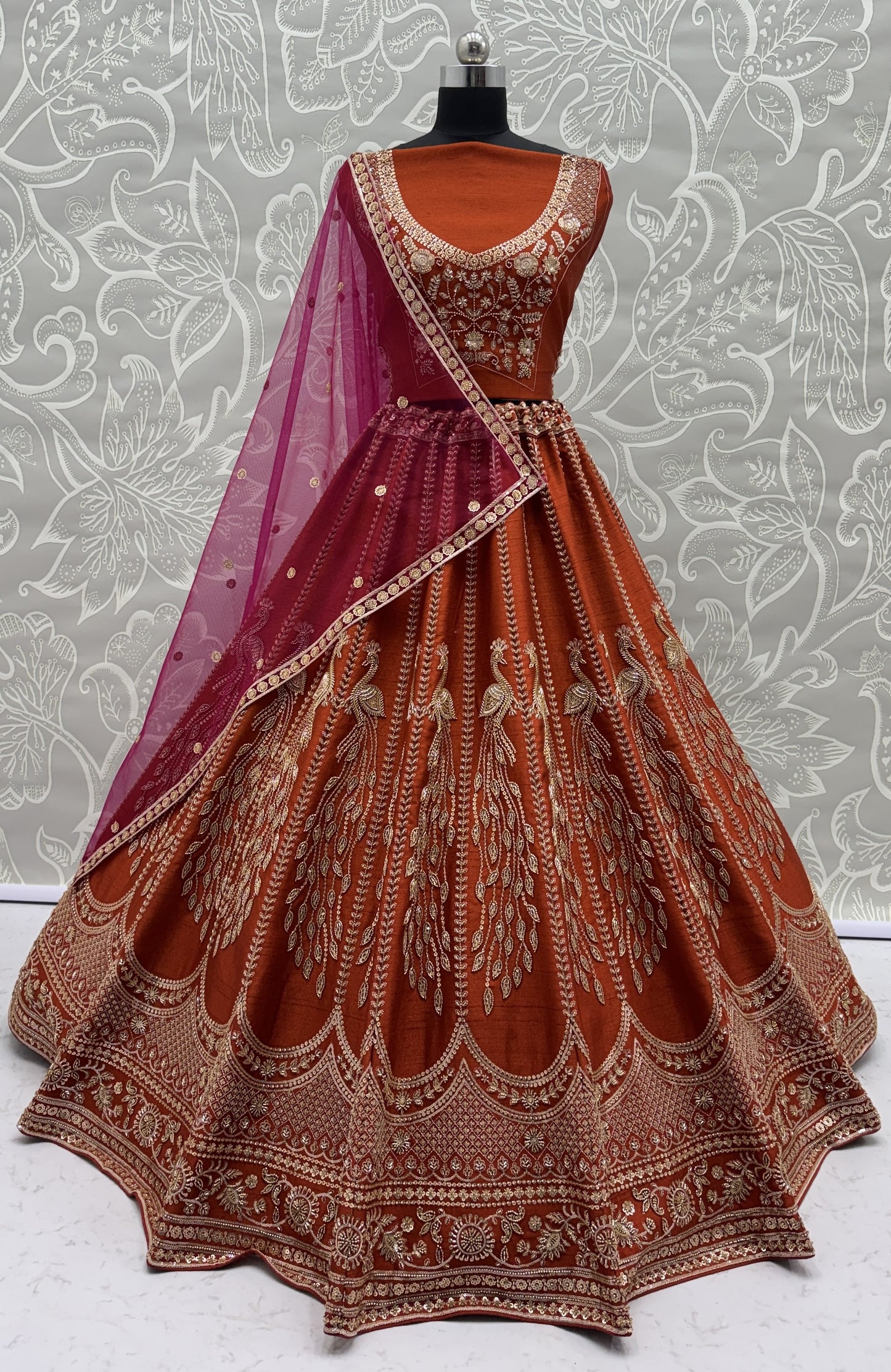 Rust Orange Silk Bridal Lehenga Choli with Peacock Embroidery & Designer Net Dupatta