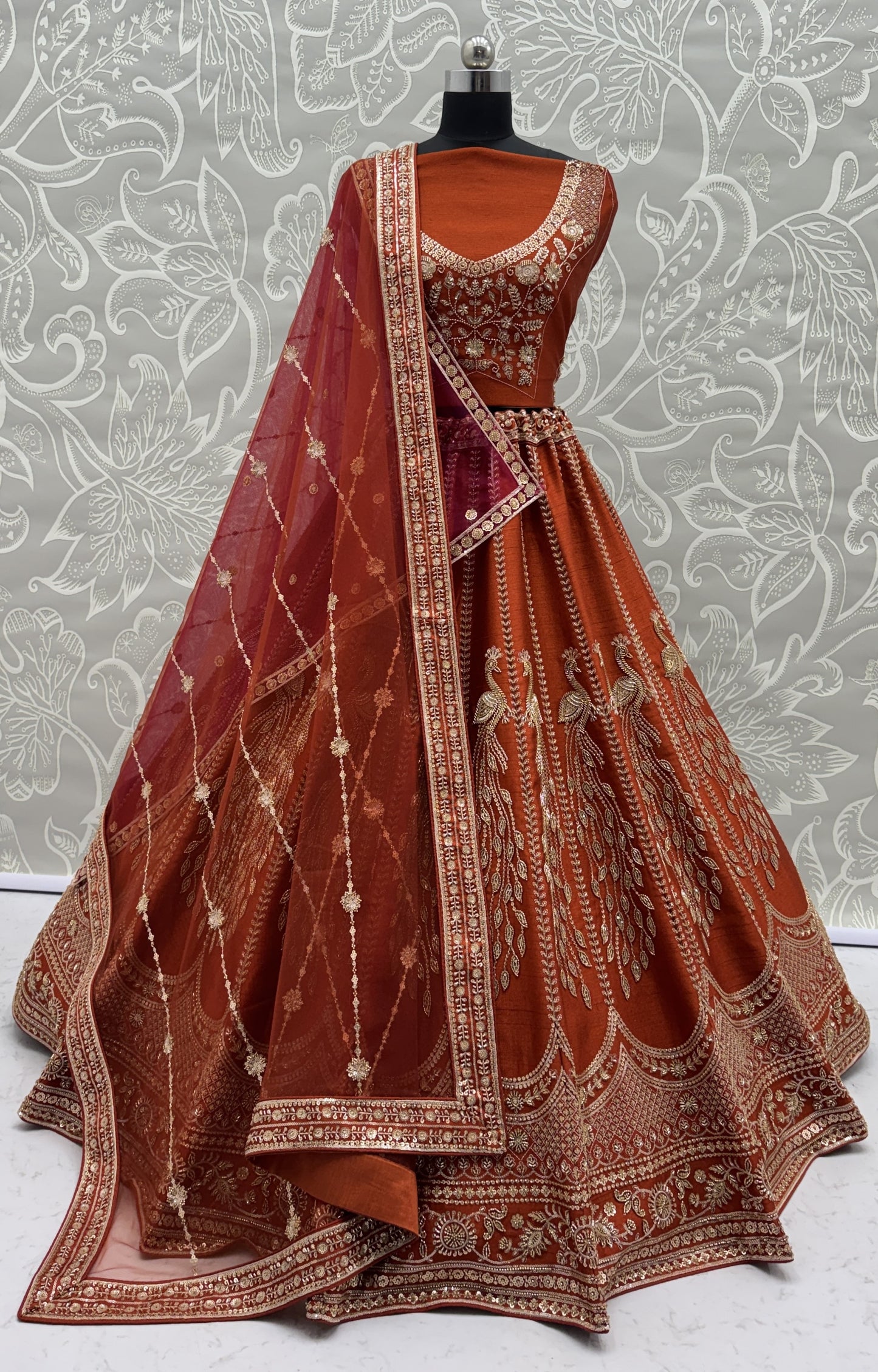 Rust Orange Silk Bridal Lehenga Choli with Peacock Embroidery & Designer Net Dupatta