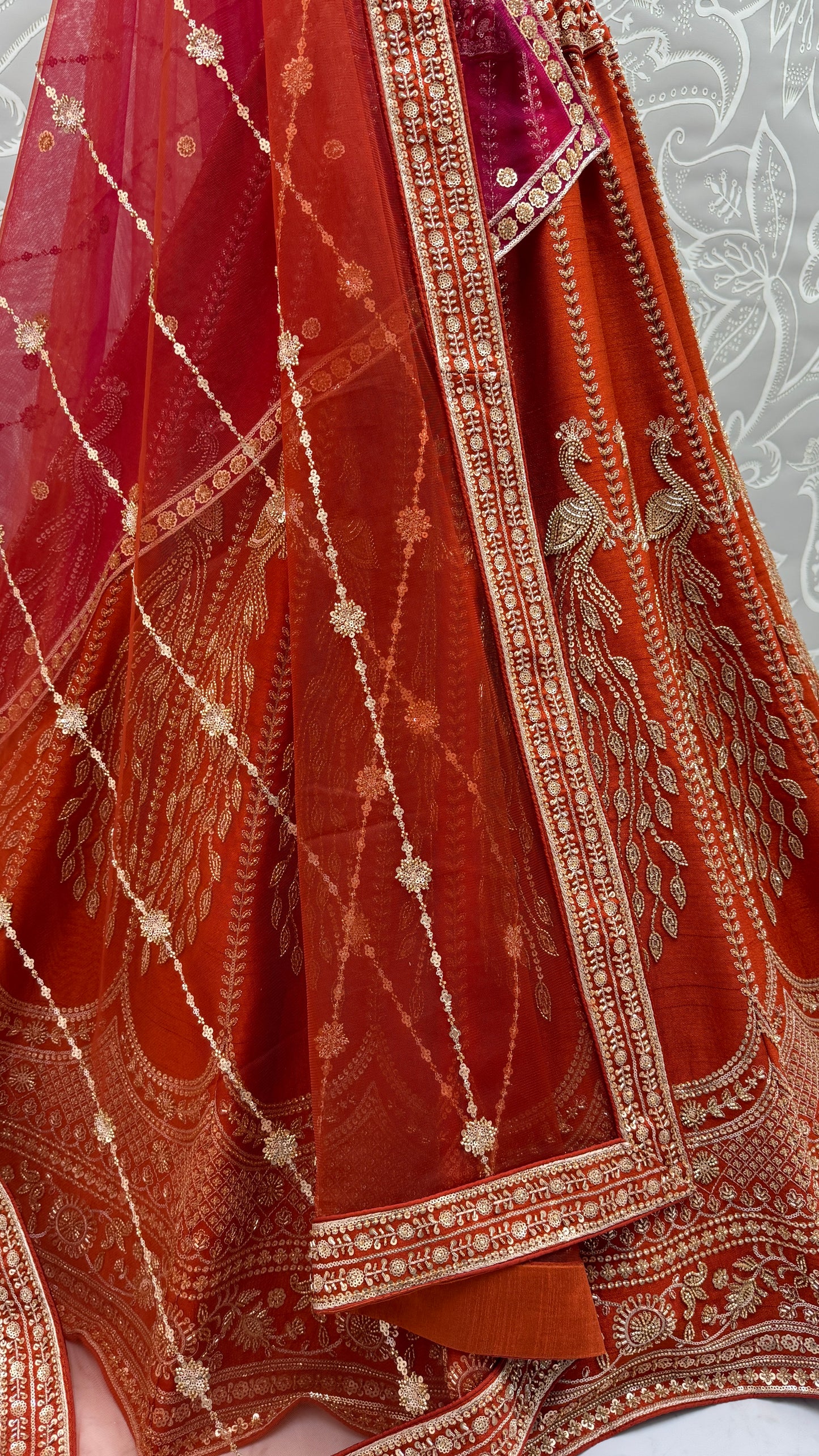Rust Orange Silk Bridal Lehenga Choli with Peacock Embroidery & Designer Net Dupatta