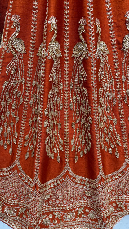 Rust Orange Silk Bridal Lehenga Choli with Peacock Embroidery & Designer Net Dupatta
