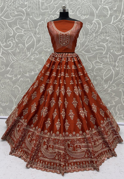Rust Orange Slub Silk Bridal Lehenga Choli with Handcrafted Motif Work, Crystal Pipe Work & Net Dupatta