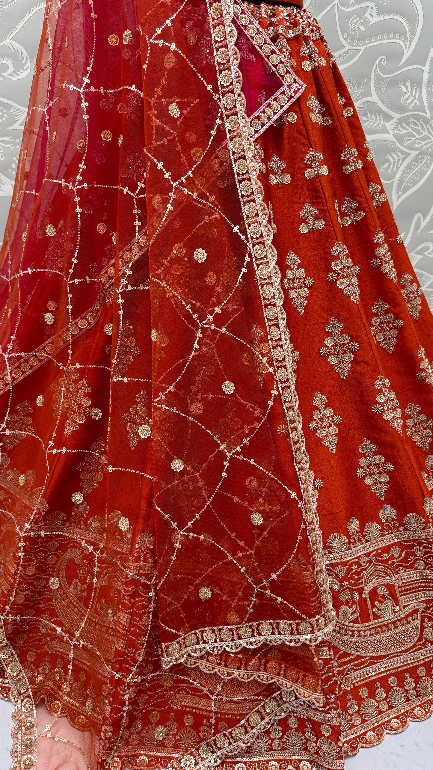 Rust Orange Slub Silk Bridal Lehenga Choli with Handcrafted Motif Work, Crystal Pipe Work & Net Dupatta