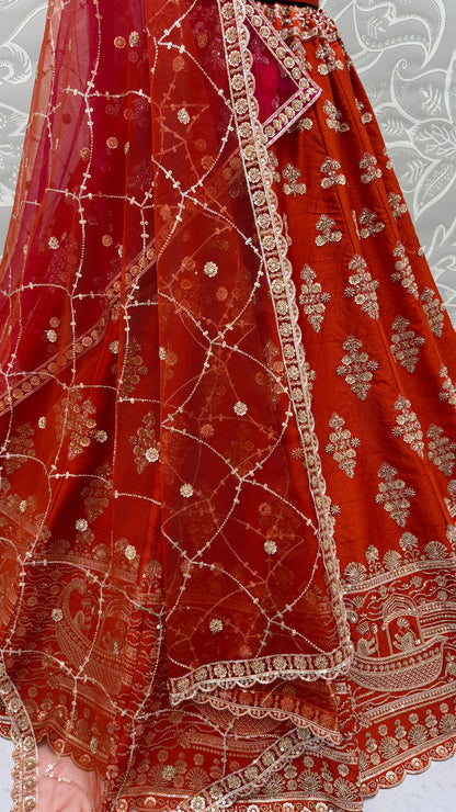 Rust Orange Slub Silk Bridal Lehenga Choli with Handcrafted Motif Work, Crystal Pipe Work & Net Dupatta