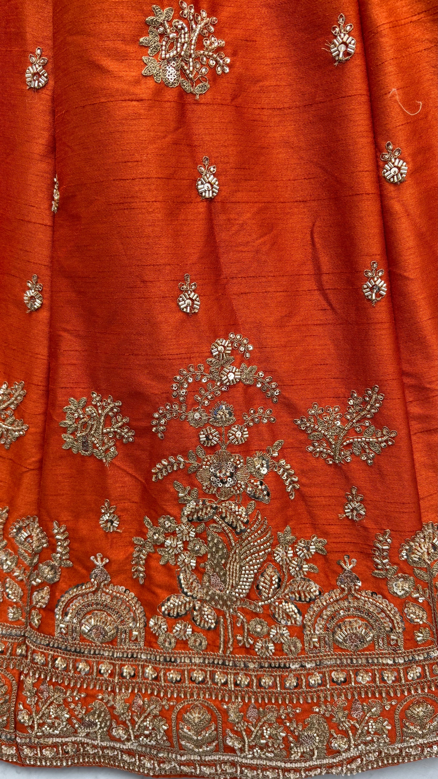 Rust Orange Gadhwal Silk Bridal Lehenga Choli with Zari Embroidery, Bead Work & Designer Net Dupatta