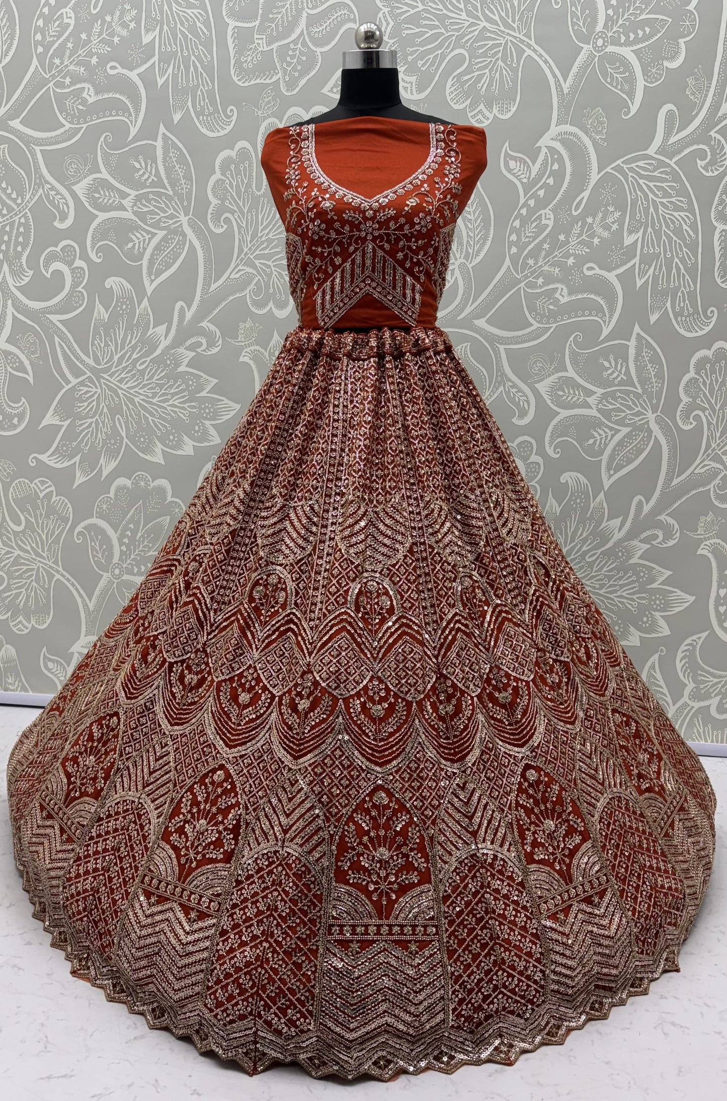 Rust Orange Net Party Wear Lehenga Choli with Crystal Motif & Sequins Work