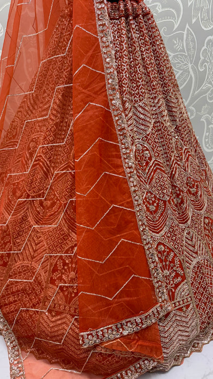 Rust Orange Net Party Wear Lehenga Choli with Crystal Motif & Sequins Work