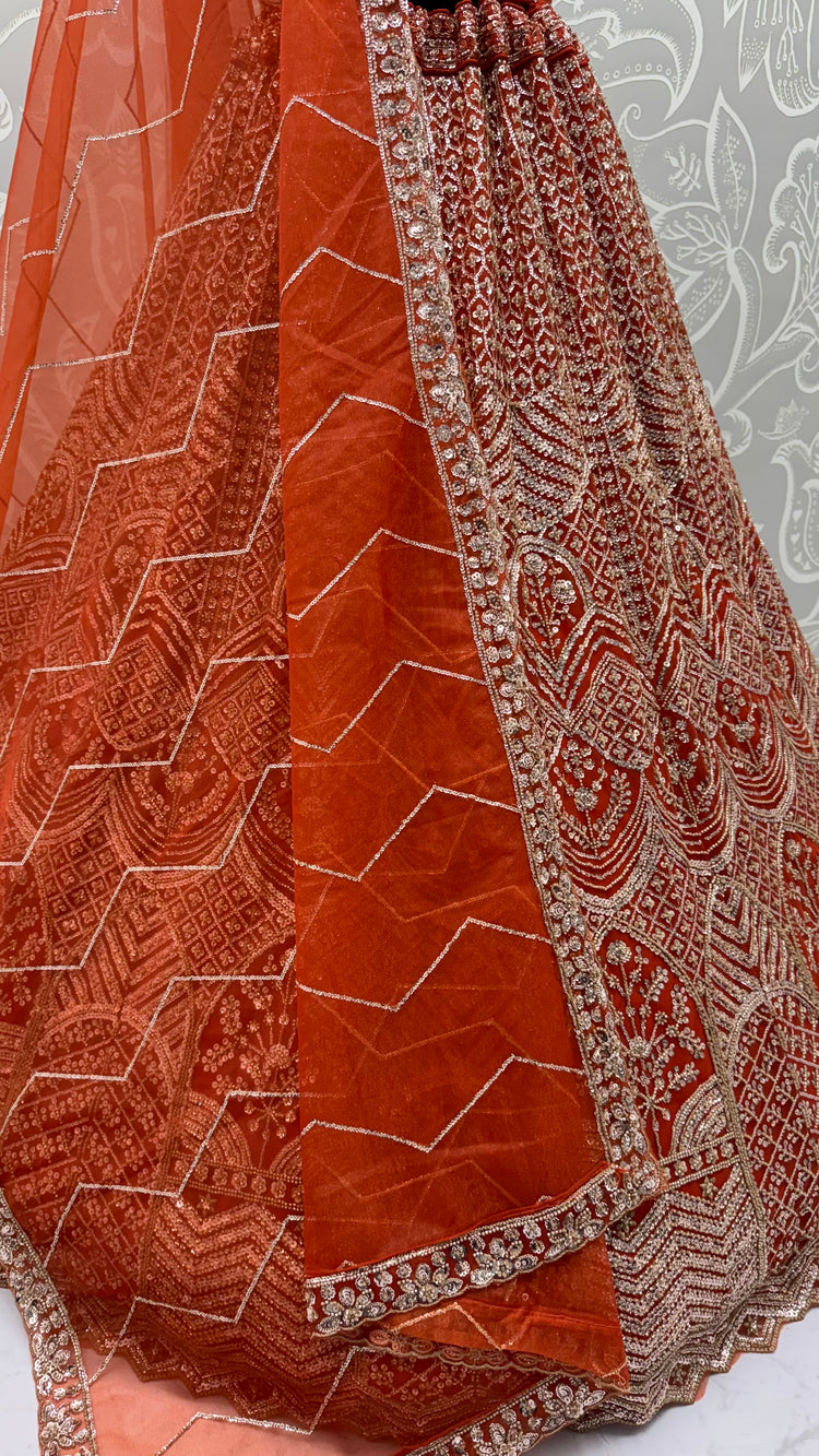Rust Orange Net Party Wear Lehenga Choli with Crystal Motif & Sequins Work