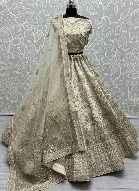 Various embroidery pattern crafted in heavy silk fabric Partywear Lehengacholi in Beige colour